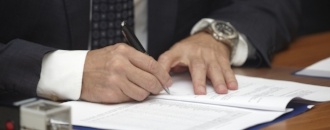 close up of businessman hands signing contract-906740-edited.jpeg