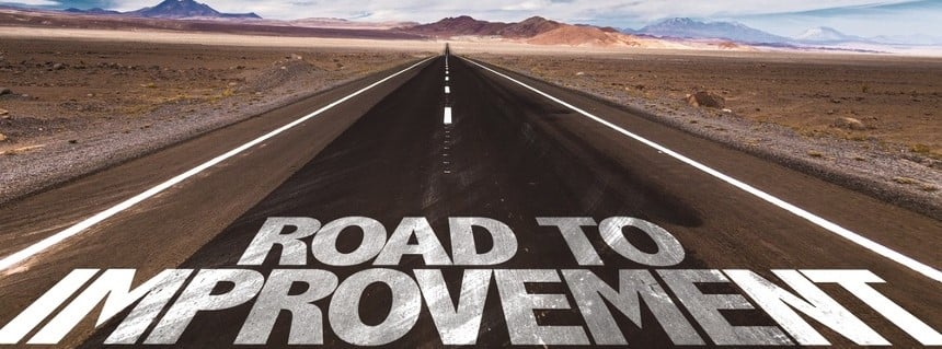 Road to Improvement written on desert road (2)