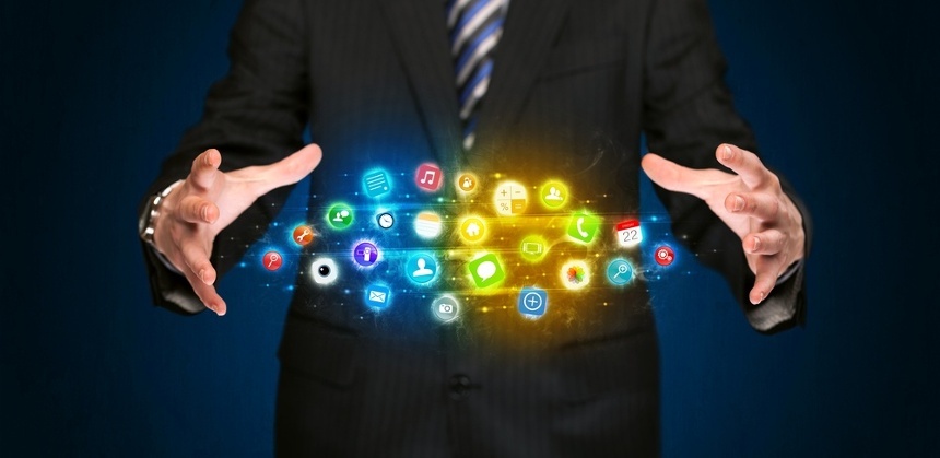 Businessman holding a shining app icon cloud in front of his body