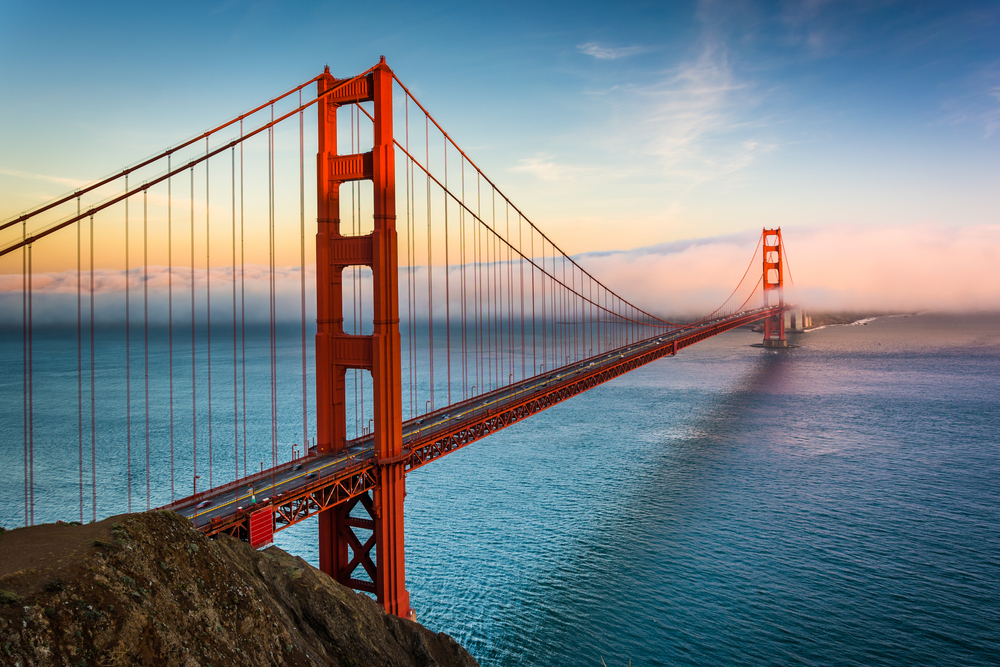 Sunset view of the Golden Gate Bridge and fog from Battery Spencer,  Golden Gate National Recreation Area, in San Francisco, California.